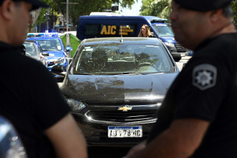 Rosario, Argentina.- In the photos taken on November 22, 2023, police and authorities carry out an inspection of the place where a car belonging to Antonela Roccuzzo's family was shot and eight million pesos were stolen in Rosario, Argentina. A group of criminals attacked the family of Antonela Roccuzzo, wife of the captain of the Argentine national team, Lionel Messi, to steal 8 billion pesos (USD22,443) from them. This is Roccuzzo's cousin, Agustina Scaglia, who was intercepted while they were traveling in a car.