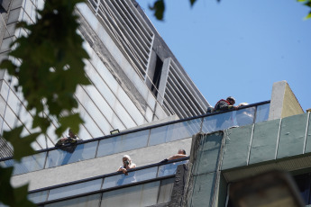 Buenos Aires, Argentina.- In the photos taken on December 12, 2023, firefighters fight the flames of a fire that broke out on two floors of a building adjacent to the headquarters of the Ministry of Labor, Employment and Social Security, in Buenos Aires. A woman died and more than eighty people had to be evacuated and treated by SAME due to the fierce fire. The first data from the investigation showed that the building did not have a gas connection, so the start of the fire could have been due to an electrical fault.