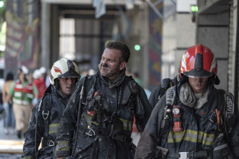 Buenos Aires, Argentina.- In the photos taken on December 12, 2023, firefighters fight the flames of a fire that broke out on two floors of a building adjacent to the headquarters of the Ministry of Labor, Employment and Social Security, in Buenos Aires. A woman died and more than eighty people had to be evacuated and treated by SAME due to the fierce fire. The first data from the investigation showed that the building did not have a gas connection, so the start of the fire could have been due to an electrical fault.